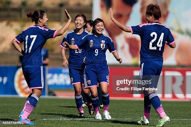 Nahomi Kawasumi and her teammates of Japan celebrate the first goal during the Women's Algarve Cup match between Japan and France on March 9, 2015 in...