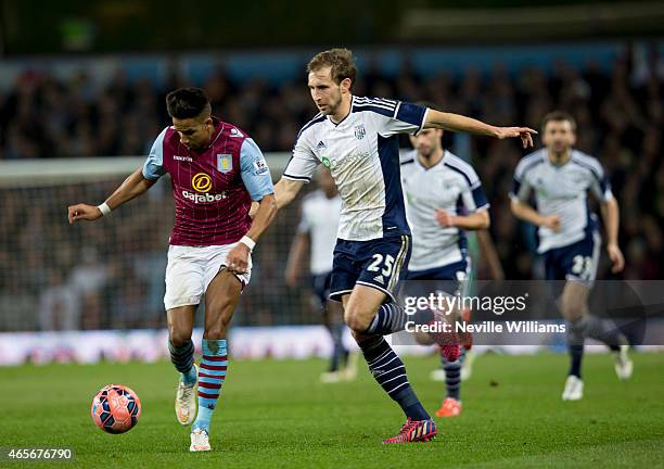 Scott Sinclair of Aston Villa is challenged by Craig Dawson of West Bromwich Albion during the FA Cup FA Cup Quarter Final match between Aston Villa...