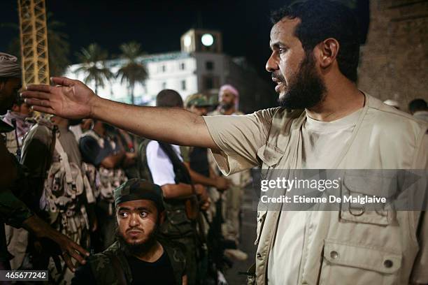 Rebels Military Commander Commander Abdelhakim Belhadj gives instructions to his troops for securing the Green Square in August 22, 2011 in...