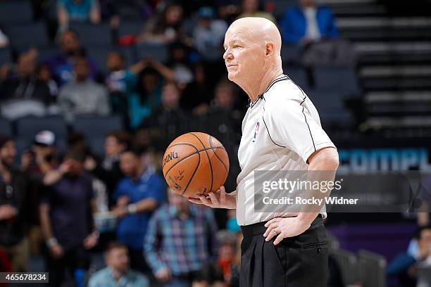 Referee Joey Crawford officiates the game between the Toronto Raptors and Charlotte Hornets on March 6, 2015 at Time Warner Cable Arena in Charlotte,...