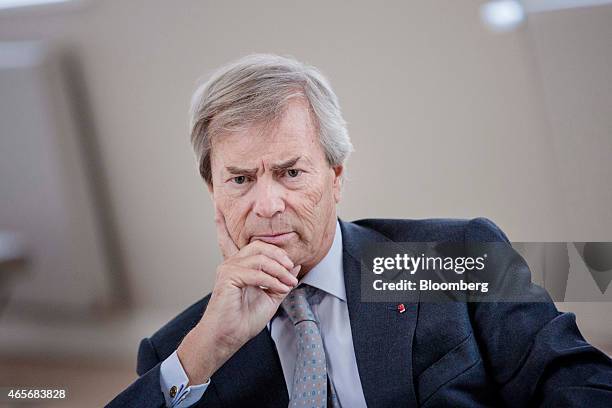 Vincent Bollore, billionaire and chairman of the Bollore Group, pauses during an interview at the Autolib' car-sharing headquarters in Vaucresson,...