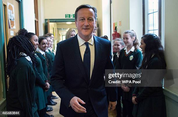 Prime Minister David Cameron meets pupils during a visit to the Green School For Girls with education secretary Nicky Morgan, on March 9, 2015 in...