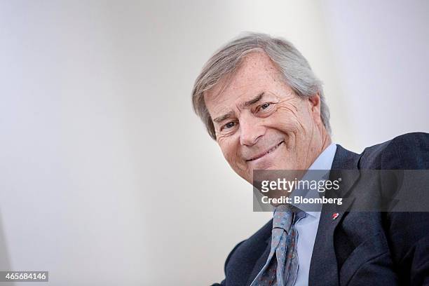 Vincent Bollore, billionaire and chairman of the Bollore Group, reacts during an interview at the Autolib' car-sharing headquarters in Vaucresson,...