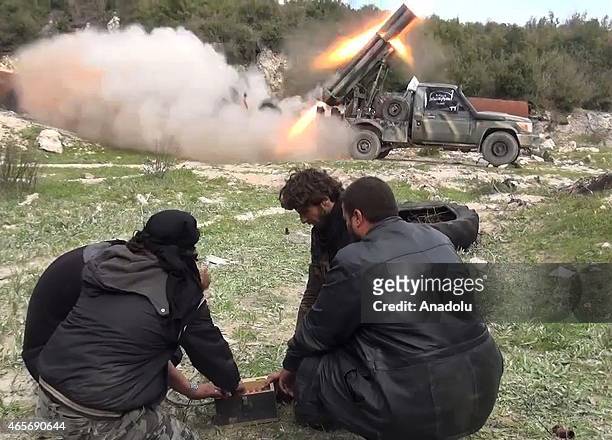Members of the anti-regimist Ahrar al-Sham brigade launch 'Grad missiles' during an operation against Syrian Regime forces deployed in the Latakia,...