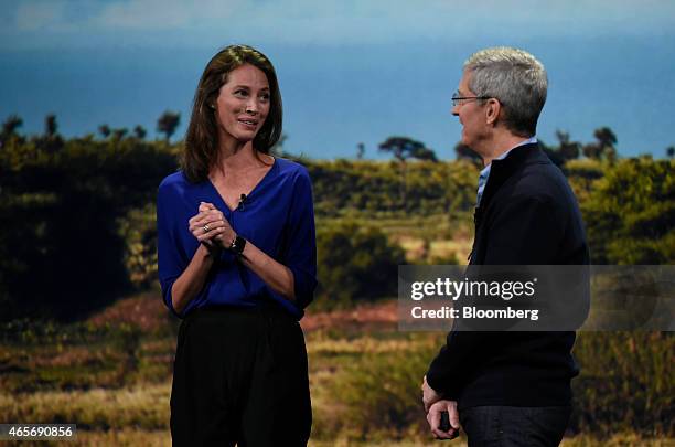 Model Christy Turlington Burns, left, speaks with Tim Cook, chief executive officer of Apple Inc., while on stage during the Apple Inc. Spring...