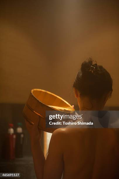 a japanese woman in a bathroom - japanese women bath stock pictures, royalty-free photos & images