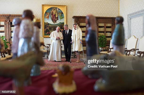 Pope Francis exchanges gifts with King Philippe of Belgium and Queen Mathilde of Belgium at his private library in the Apostolic Palace on March 9,...