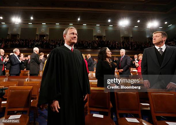 Supreme Court Chief Justice John Roberts arrives ahead of U.S. President Barack Obama's State of the Union address to a joint session of Congress at...