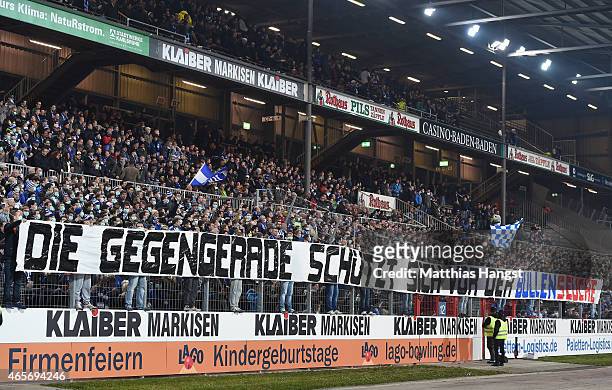 Fans of Karlsruher SC with masks protest against RB Leipzig prior to the Second Bundesliga match between Karlsruher SC and RB Leipzig at Wildpark...