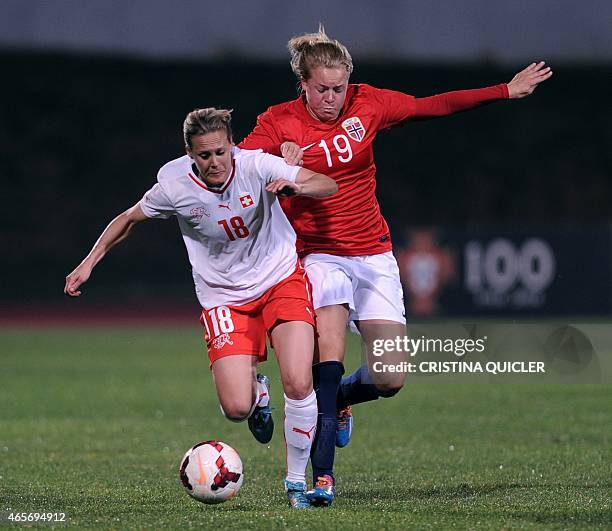 Norway's forward Marie D. Markussen vies Switzerland's midfielder Vanessa Burki during the Algarve Cup football match Norway vs Switzerland at the...