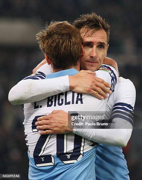 Miroslav Klose with his teammate Lucas Biglia of SS Lazio celebrates after scoring the third team's goal during the Serie A match between SS Lazio...