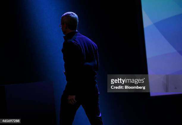 Tim Cook, chief executive officer of Apple Inc., exits after speaking at the Apple Inc. Spring Forward event in San Francisco, California, U.S., on...