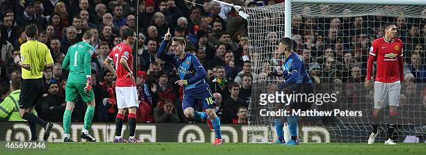 Nacho Monreal of Arsenal celebrates scoring their first goal during the FA Cup Quarter Final match between Manchester United and Arsenal at Old...