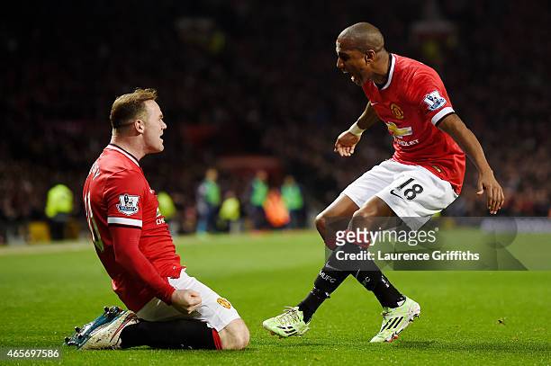 Wayne Rooney of Manchester United is congratulated by teammate Ashley Young of Manchester United after scoring a goal to level the scores at 1-1...