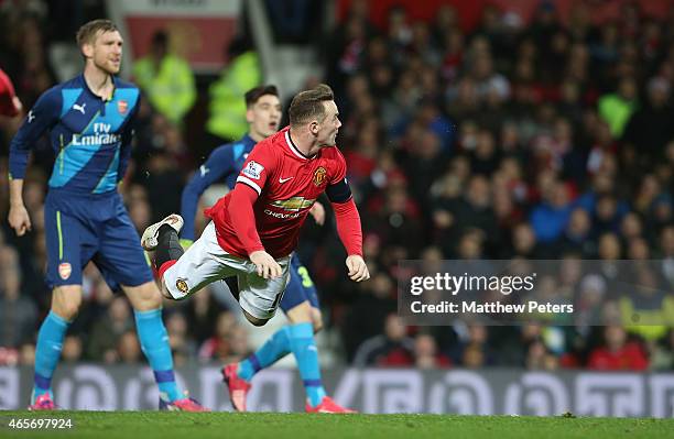 Wayne Rooney of Manchester United scores their first goal during the FA Cup Quarter Final match between Manchester United and Arsenal at Old Trafford...