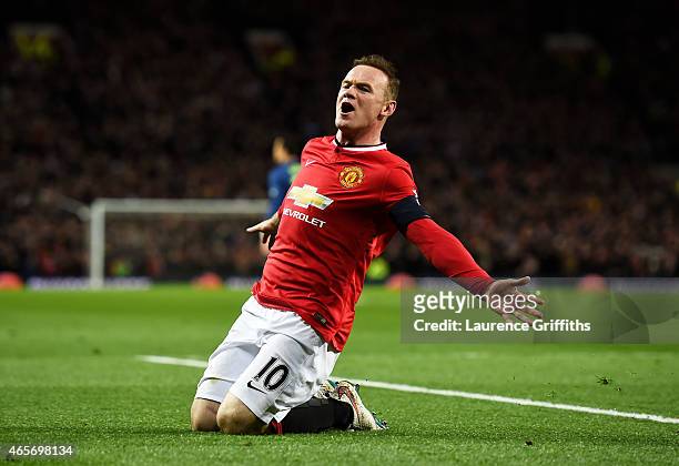 Wayne Rooney of Manchester United celebrates after scoring a goal to level the scores at 1-1 during the FA Cup Quarter Final match between Manchester...