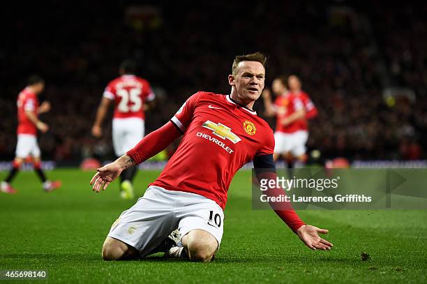 Wayne Rooney of Manchester United celebrates after scoring a goal to level the scores at 1-1 during the FA Cup Quarter Final match between Manchester...