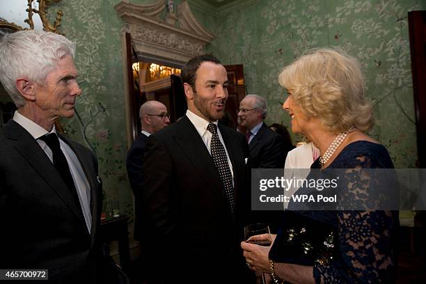 Camilla, Duchess of Cornwall, meets U.S. Fashion designer Tom Ford, center, and his husband, writer and journalist, Richard Buckley, during a...