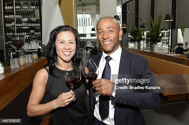 Former Wallabies captain George Gregan and wife Erica Gregan enjoy a glass of red wine at their cafe GG Espresso on January 29, 2014 in Brisbane,...