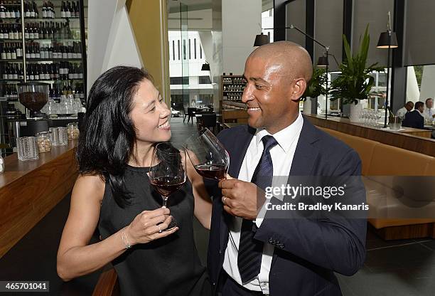 Former Wallabies captain George Gregan and wife Erica Gregan enjoy a glass of red wine at their cafe GG Espresso on January 29, 2014 in Brisbane,...