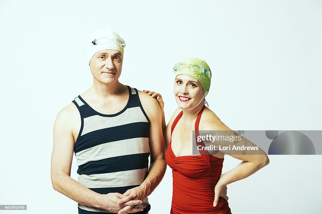 Vacation couple wearing retro bathing cap swimsuit