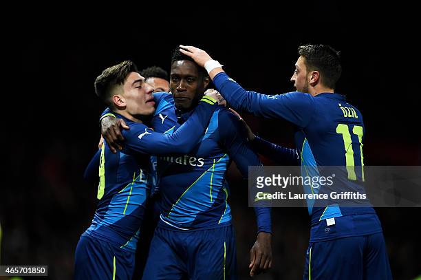 Danny Welbeck of Arsenal celebrates with teammates Hector Bellerin and Mesut Oezil of Arsenal after scoring his team's second goal during the FA Cup...