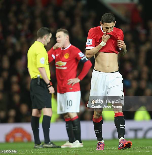Angel di Maria of Manchester United walks off after being sent off during the FA Cup Quarter Final match between Manchester United and Arsenal at Old...