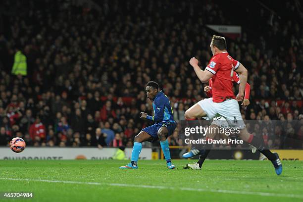 Danny Welbeck scores Arsenal's 2nd goal during the match between Manchester United and Arsenal in the FA Cup 6th Round at Old Trafford on March 9,...