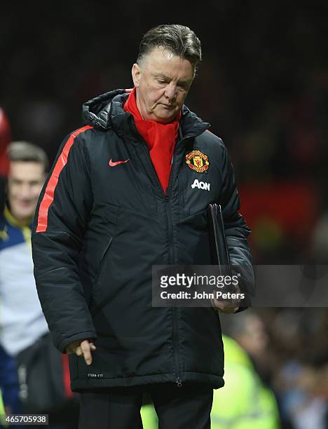 Manager Louis van Gaal of Manchester United walks off after the FA Cup Quarter Final match between Manchester United and Arsenal at Old Trafford on...