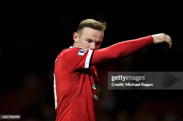 Dejected Wayne Rooney of Manchester United walks off the pitch following his team's 2-1 defeat during the FA Cup Quarter Final match between...