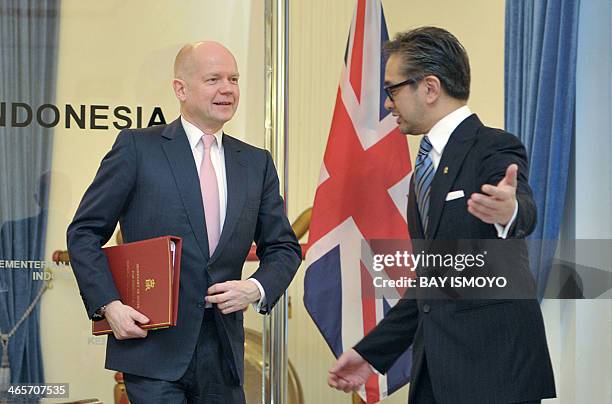 Indonesian Foreign Minister Marty Natalegawa welcomes British Foreign Secretary William Hague before a meeting in Jakarta on January 29, 2014. Hague...
