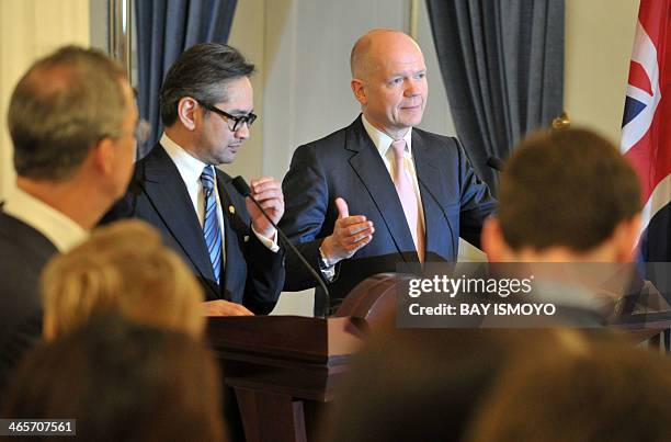 Indonesian Foreign Minister Marty Natalegawa and British Foreign Secretary William Hague brief journalists during a press conference after a meeting...