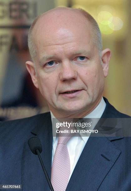 British Foreign Secretary William Hague briefs journalists during a press conference after a meeting with Indonesian Foreign Minister Marty...