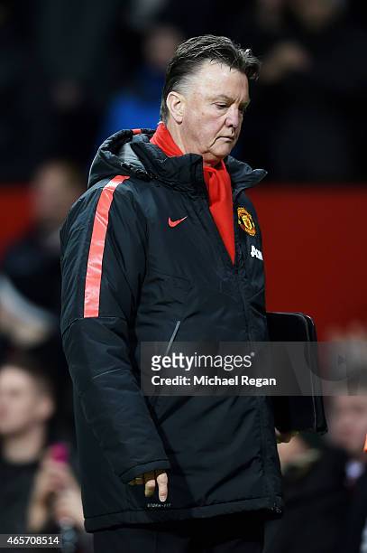 Dejected Louis van Gaal the manager of Manchester United walks off the pitch following his team's 2-1 defeat during the FA Cup Quarter Final match...