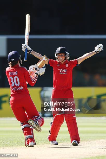 Charlotte Edwards of England celebrates hitting the winning runs with Sarah Taylor during game one of the International Twenty20 series between...