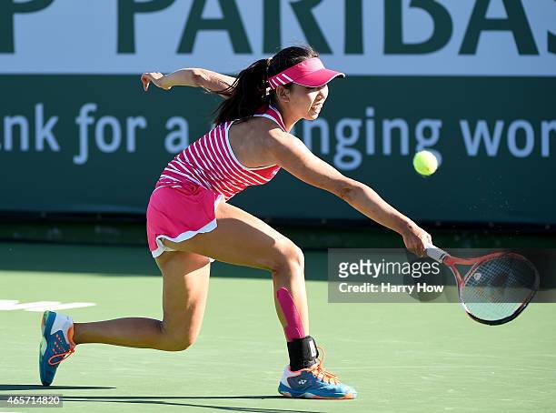 Mayo Hibi of Japan plays a backhand against Lesia Tsurenko of Ukraine during qualifying of the BNP Paribas Open tennis at the Indian Wells Tennis...
