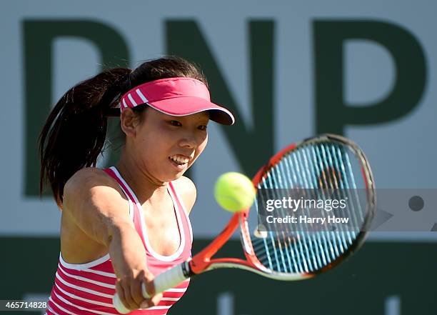 Mayo Hibi of Japan plays a backhand against Lesia Tsurenko of Ukraine during qualifying of the BNP Paribas Open tennis at the Indian Wells Tennis...