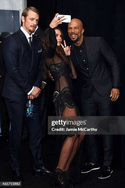 Joel Kinnaman, Genesis Rodriguez, and Common attend the "Run All Night" New York Premiere at AMC Lincoln Square Theater on March 9, 2015 in New York...