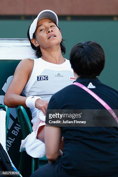 Kimiko Date-Krumm of Japan looks frustrated as she retires injured in her match against Lauren Embree of USA during day one of the BNP Paribas Open...