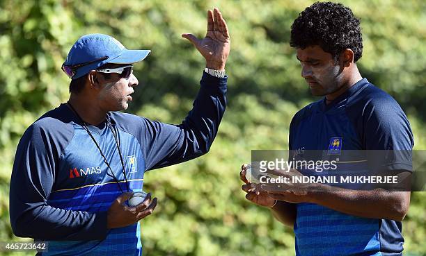 Former Sri Lanka fast bowler and current bowling coach Chaminda Vaas speaks to Thisara Perera during a training session at the Bellerive Oval ground...