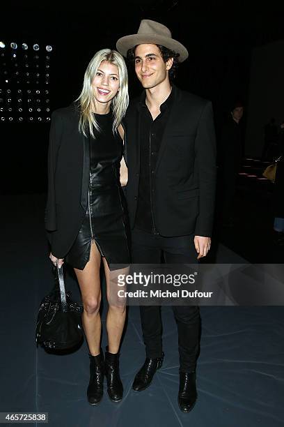 Devon Windsor and Fai Khadra Attend the Saint Laurent show as part of the Paris Fashion Week Womenswear Fall/Winter 2015/2016 on March 9, 2015 in...