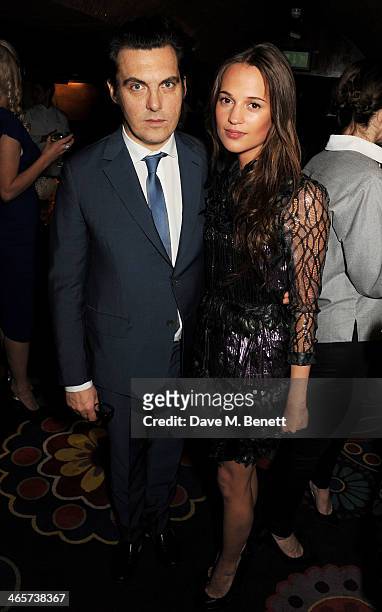 Joe Wright and Alicia Vikander attend the Charles Finch and Chanel Pre-BAFTA cocktail party and dinner at Annabel's on February 8, 2013 in London,...