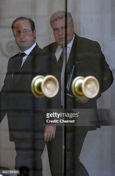 French President Francois Hollande accompanies Junior Minister for Transports and Maritime Economy, Frederic Cuvillier after a weekly cabinet meeting...