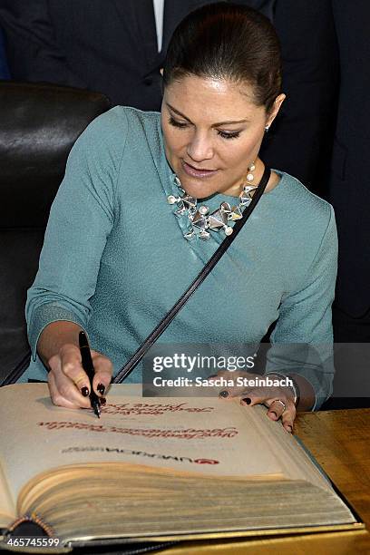 Crown Princess Victoria of Sweden signs the 'steelbook' of Essen during her visit in North Rhine-Westphalia at Zeche Zollverein on January 29, 2014...