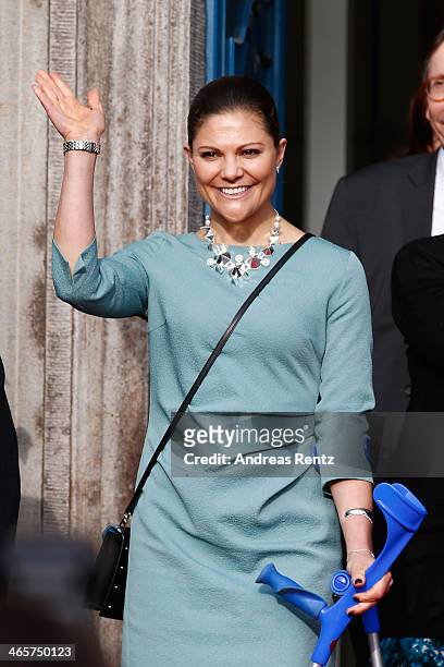 Crown Princess Victoria of Sweden waves to supporters after her visit at the town hall on January 29, 2014 in Dusseldorf, Germany.