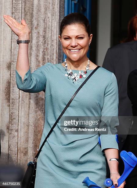 Crown Princess Victoria of Sweden waves to supporters after her visit at the town hall on January 29, 2014 in Dusseldorf, Germany.