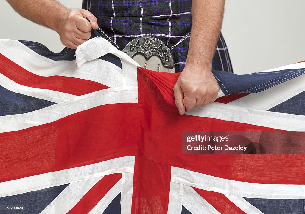 Scotsman tearing Union Jack...