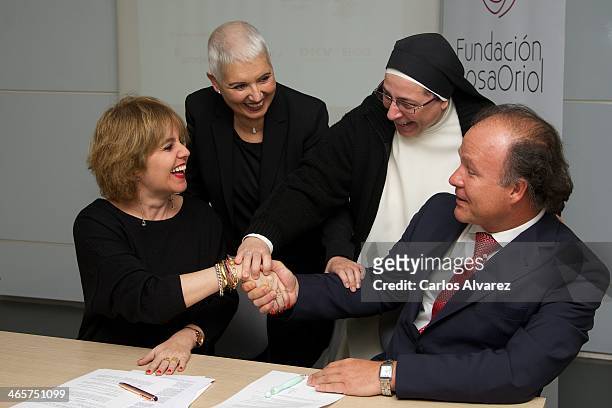 Rosa Tous, Rosa Oriol, Sor Lucia Caram and Ernesto Manrique pose for the photographers during the signing of cooperation between the Rosa Oriol...