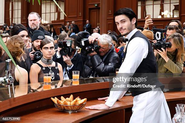 Model Cara Delevingne and Baptiste Giabiconi pose after the Chanel show as part of the Paris Fashion Week Womenswear Fall/Winter 2015/2016 on March...