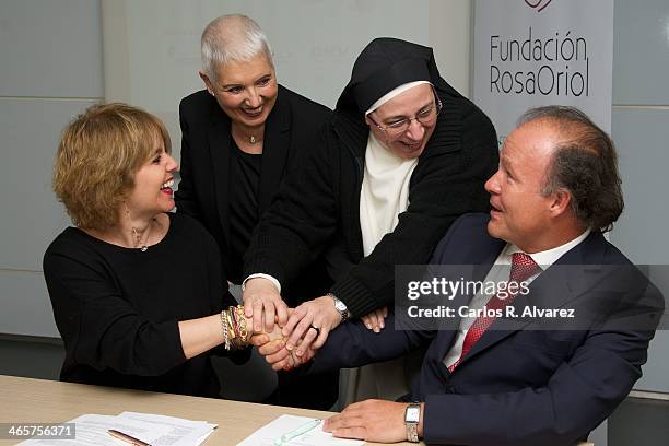 Rosa Tous, Rosa Oriol, Sor Lucia Caram and Ernesto Manrique pose for the photographers during the signing of cooperation between the Rosa Oriol...